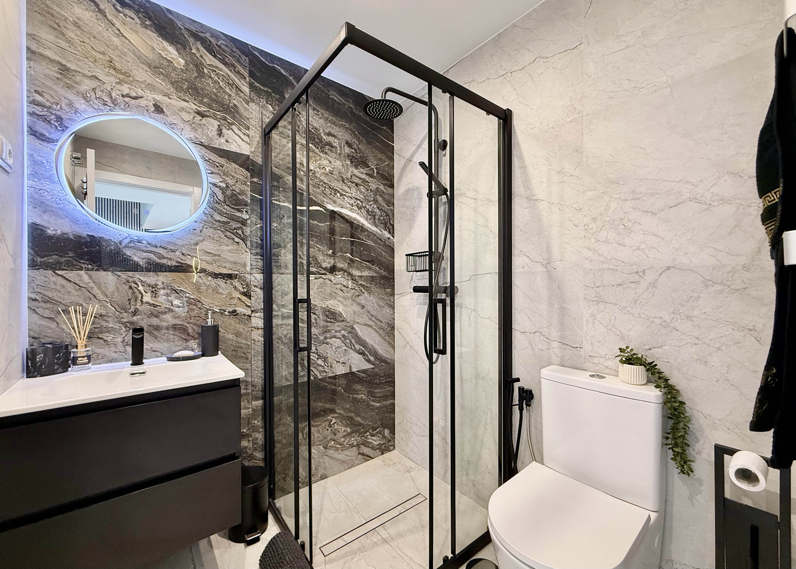 Luxury guest bathroom with walk-in shower in Calblanque Villa at Mar Menor Golf Resort by Levante Properties.