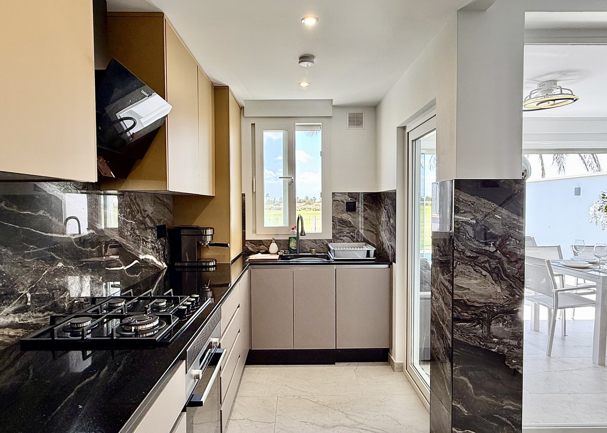 Designer kitchen with granite worktops in Mar Menor Golf Resort property by Levante Properties
