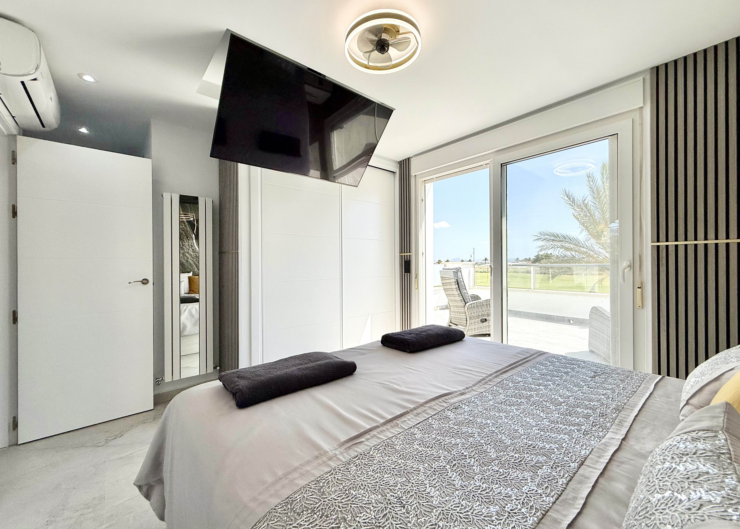 Luxury master bedroom with private terrace in Calblanque Villa at Mar Menor Golf Resort