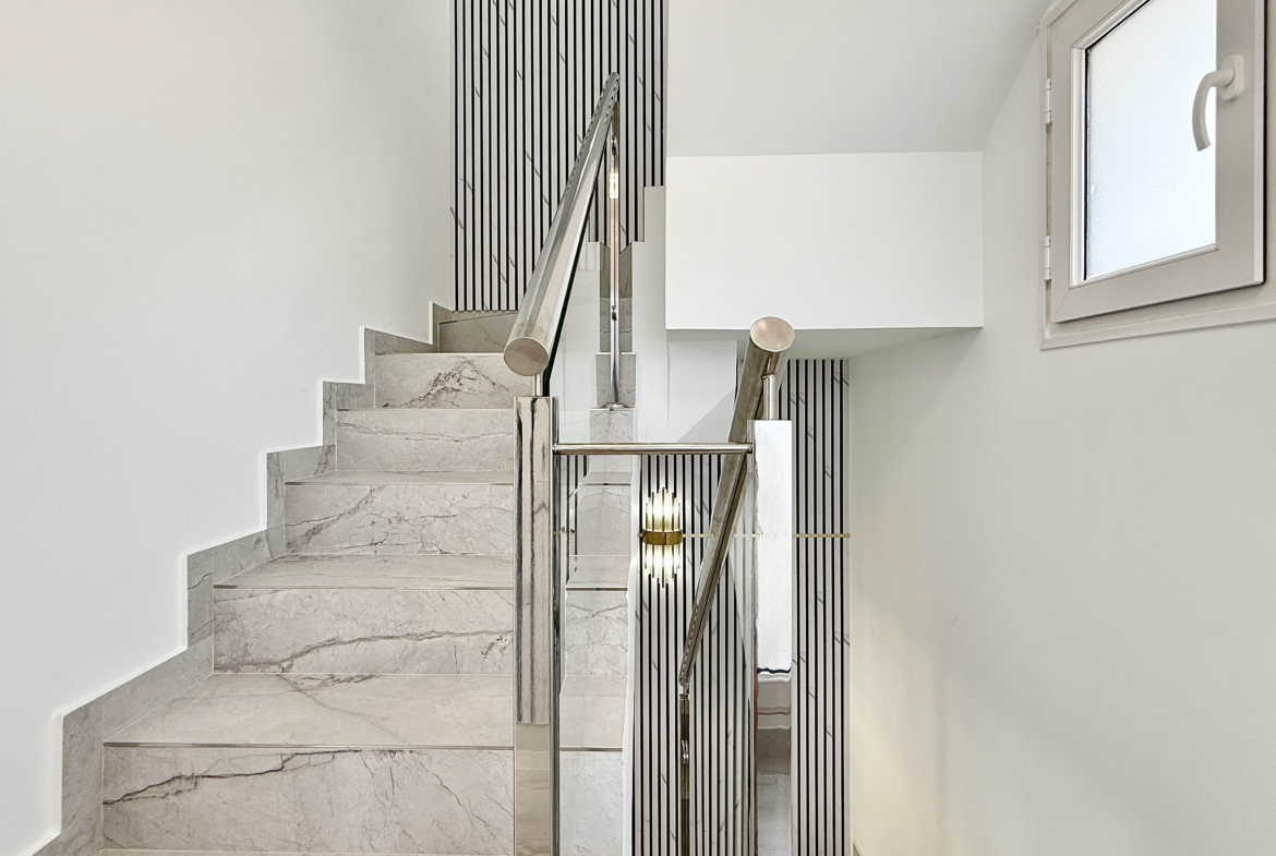 Designer staircase with glass balustrade in Calblanque Villa at Mar Menor Golf Resort