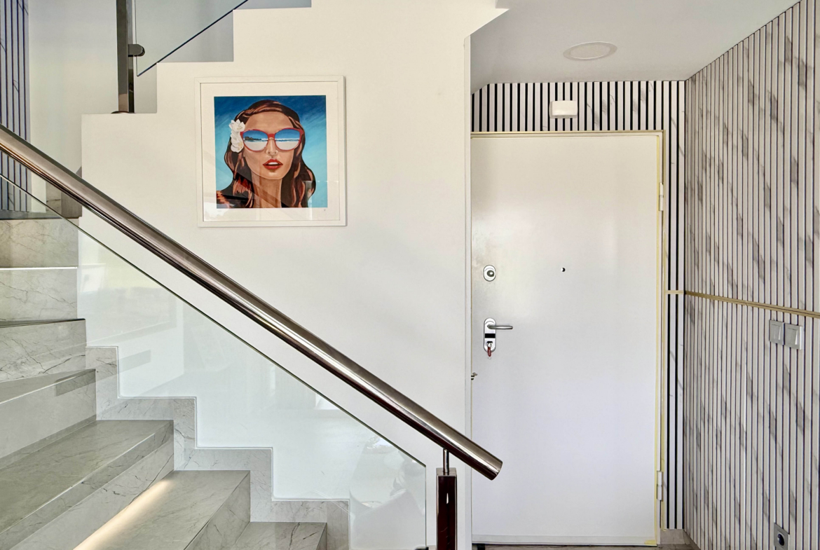 Designer staircase with glass balustrade in Calblanque Villa at Mar Menor Golf Resort