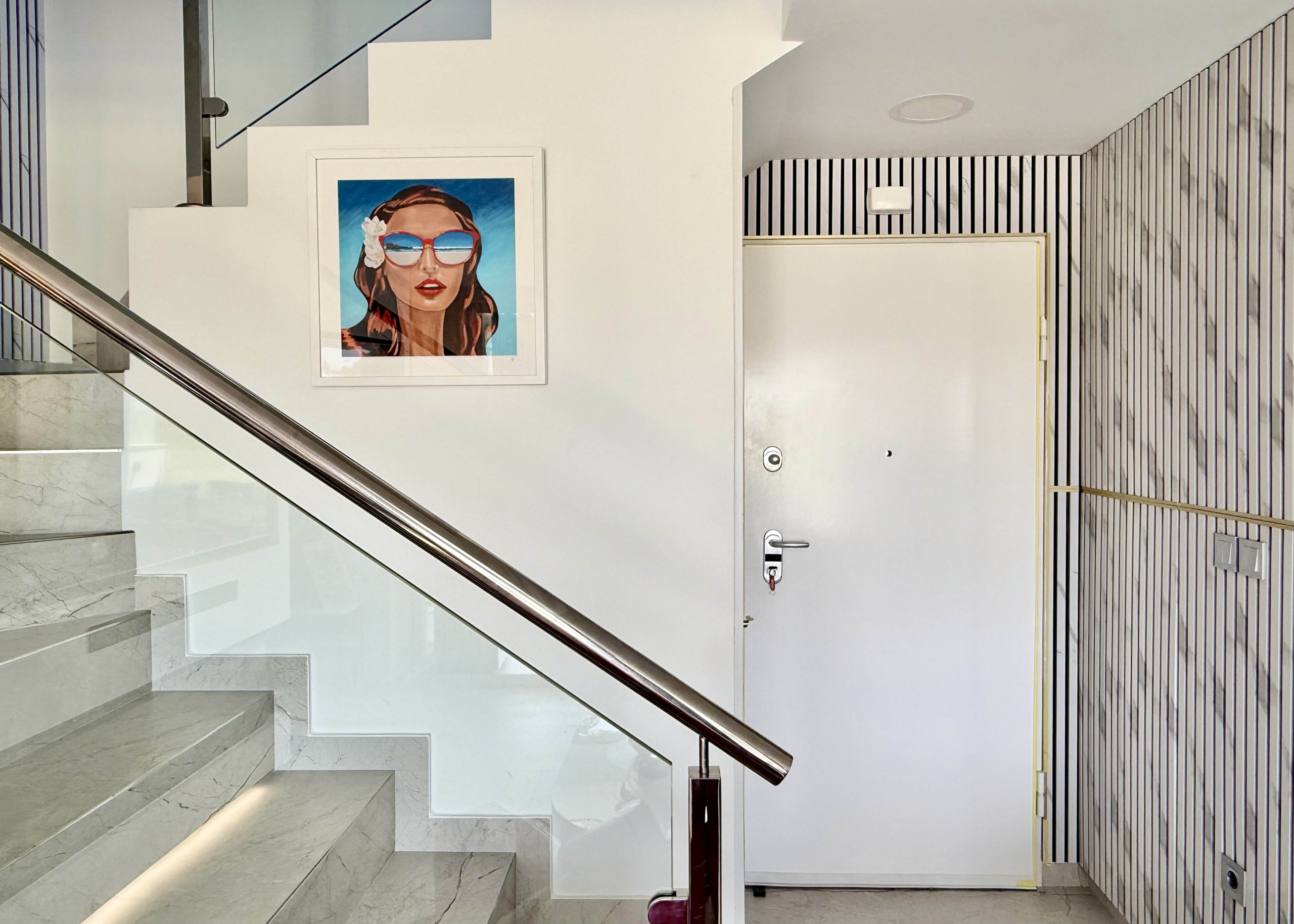 Designer staircase with glass balustrade in Calblanque Villa at Mar Menor Golf Resort