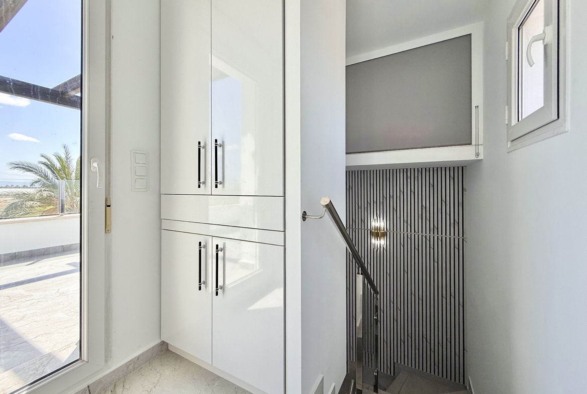 Designer staircase with glass balustrade in Calblanque Villa at Mar Menor Golf Resort