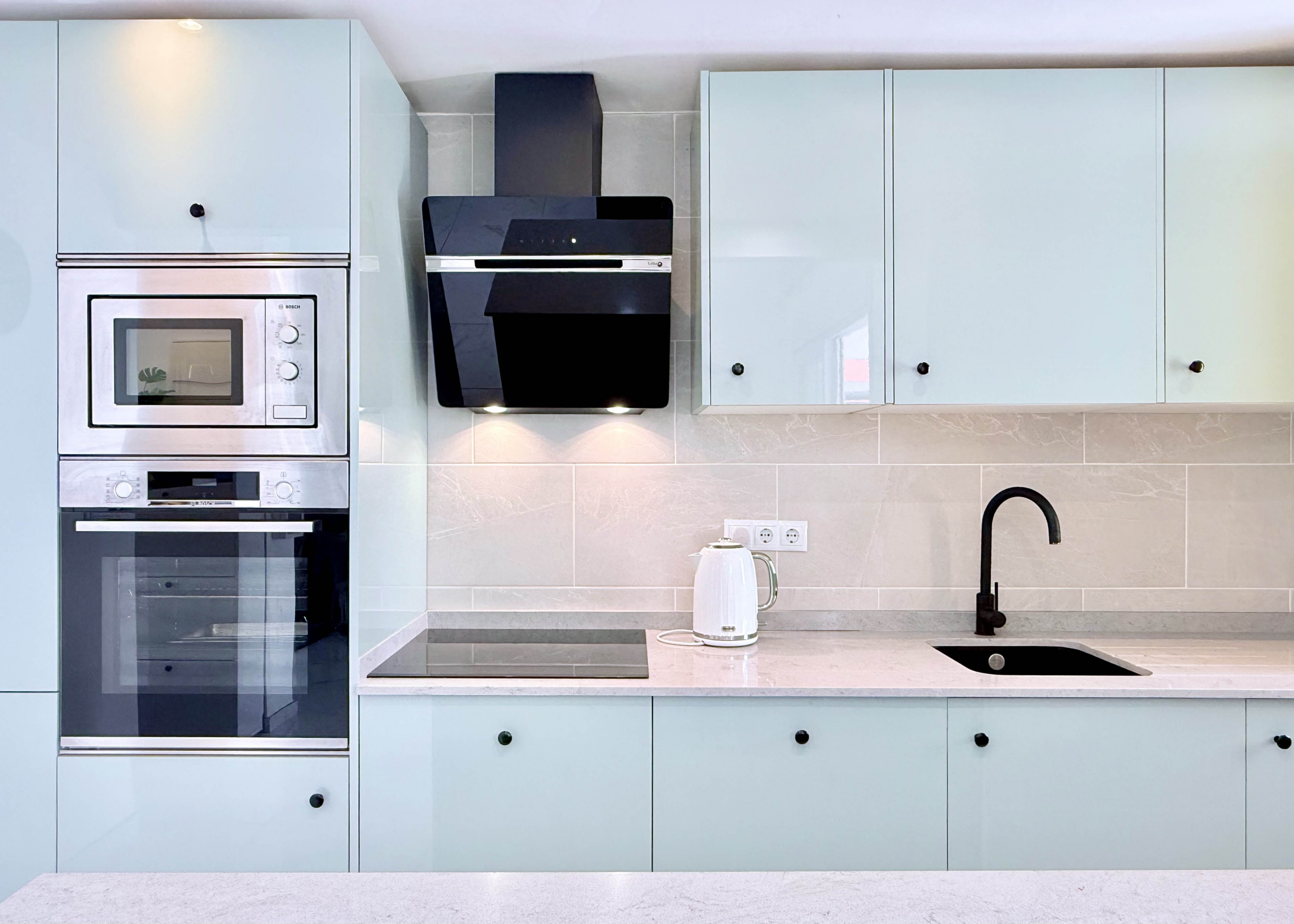 Contemporary kitchen with integrated appliances in Isla Grosa Villa on Mar Menor Golf Resort by Levante Properties