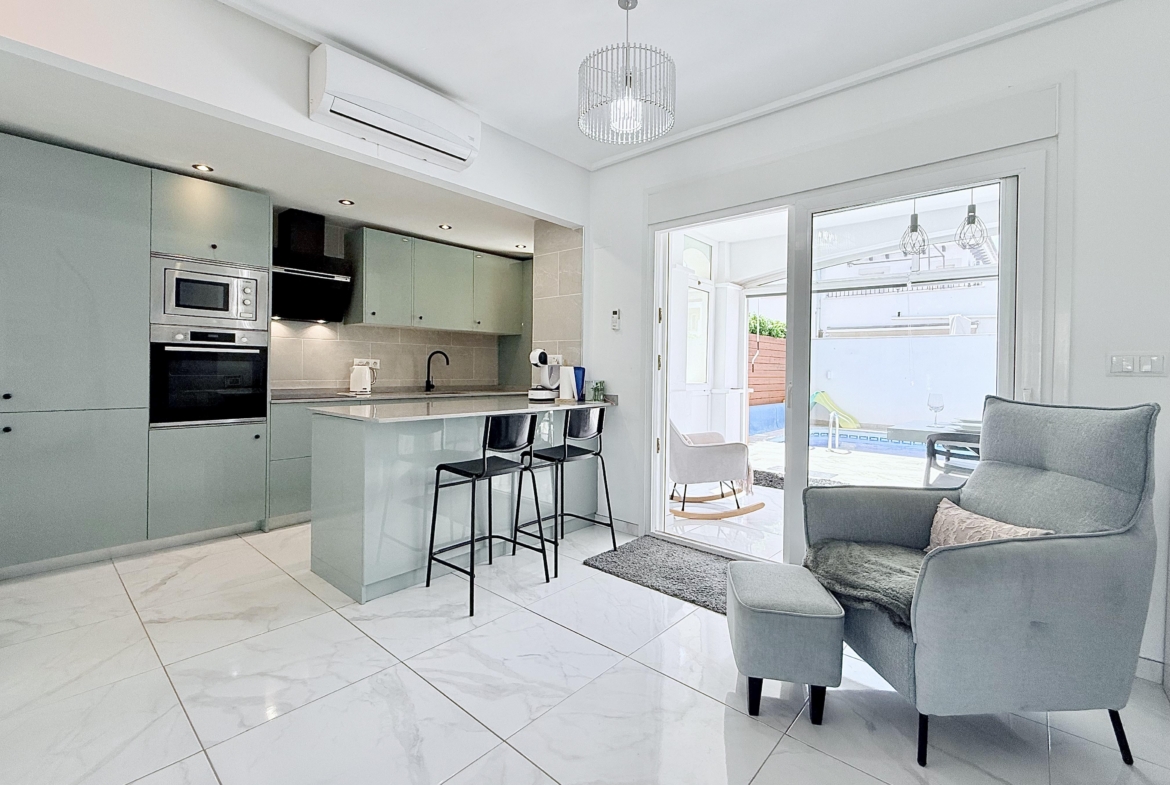 Contemporary kitchen with integrated appliances in Isla Grosa Villa on Mar Menor Golf Resort by Levante Properties