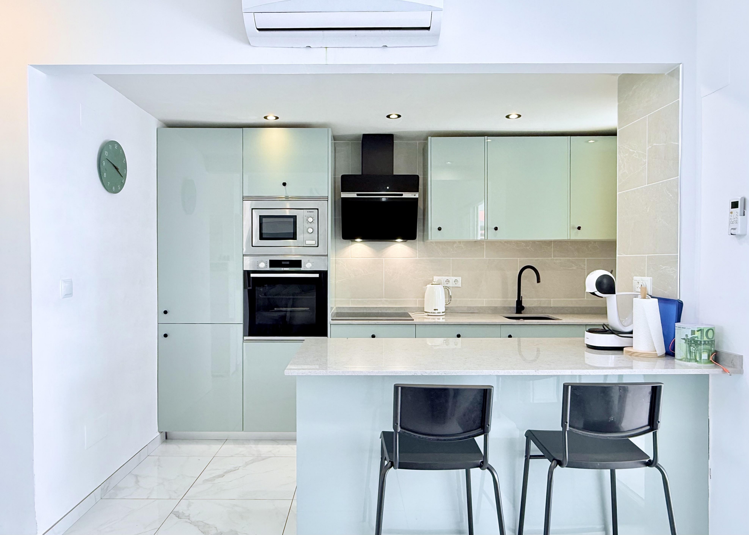 Contemporary kitchen with integrated appliances in Isla Grosa Villa on Mar Menor Golf Resort by Levante Properties