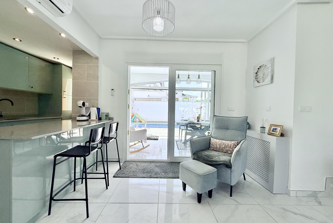 Contemporary kitchen with integrated appliances in Isla Grosa Villa on Mar Menor Golf Resort by Levante Properties