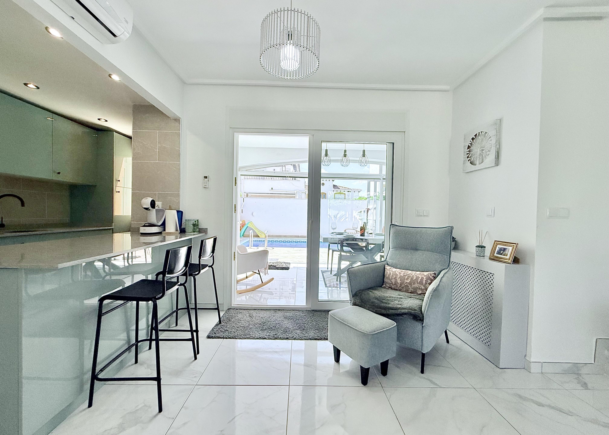 Contemporary kitchen with integrated appliances in Isla Grosa Villa on Mar Menor Golf Resort by Levante Properties