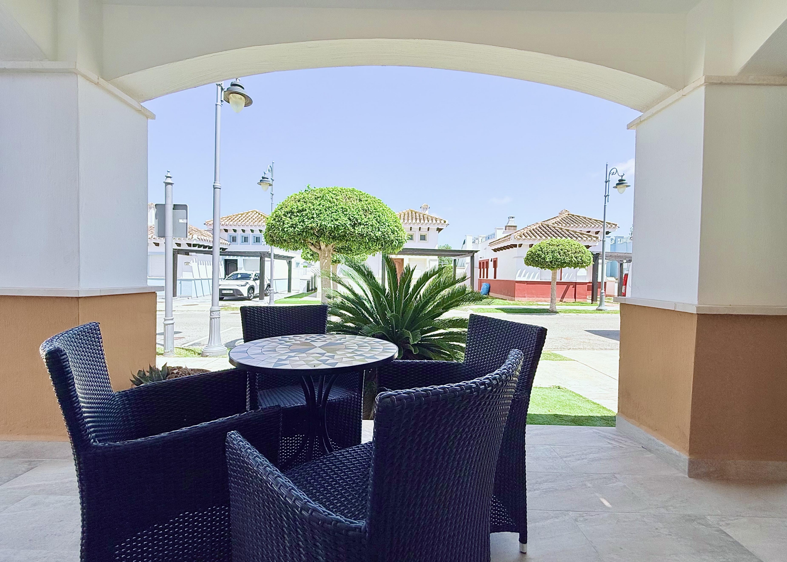Private patio accessed from the open-plan lounge at Isla Grosa Villa on Mar Menor Golf Resort by Levante Properties