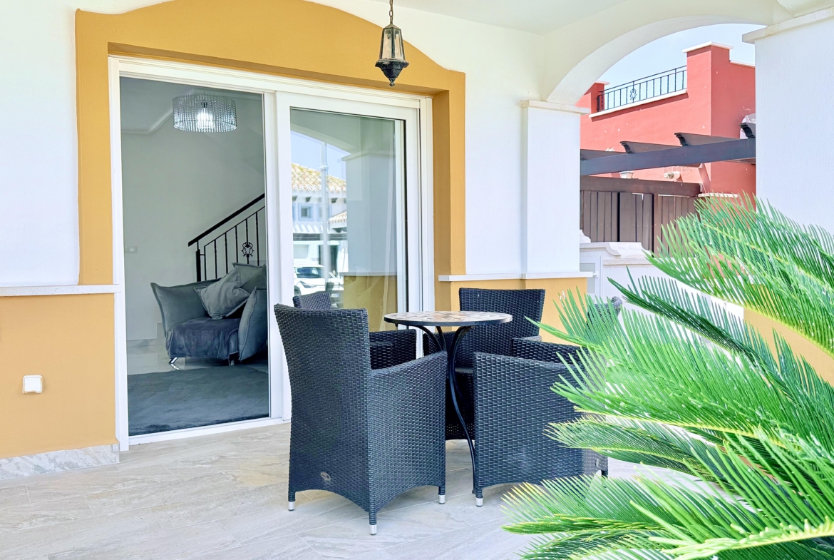 Private patio accessed from the open-plan lounge at Isla Grosa Villa on Mar Menor Golf Resort by Levante Properties