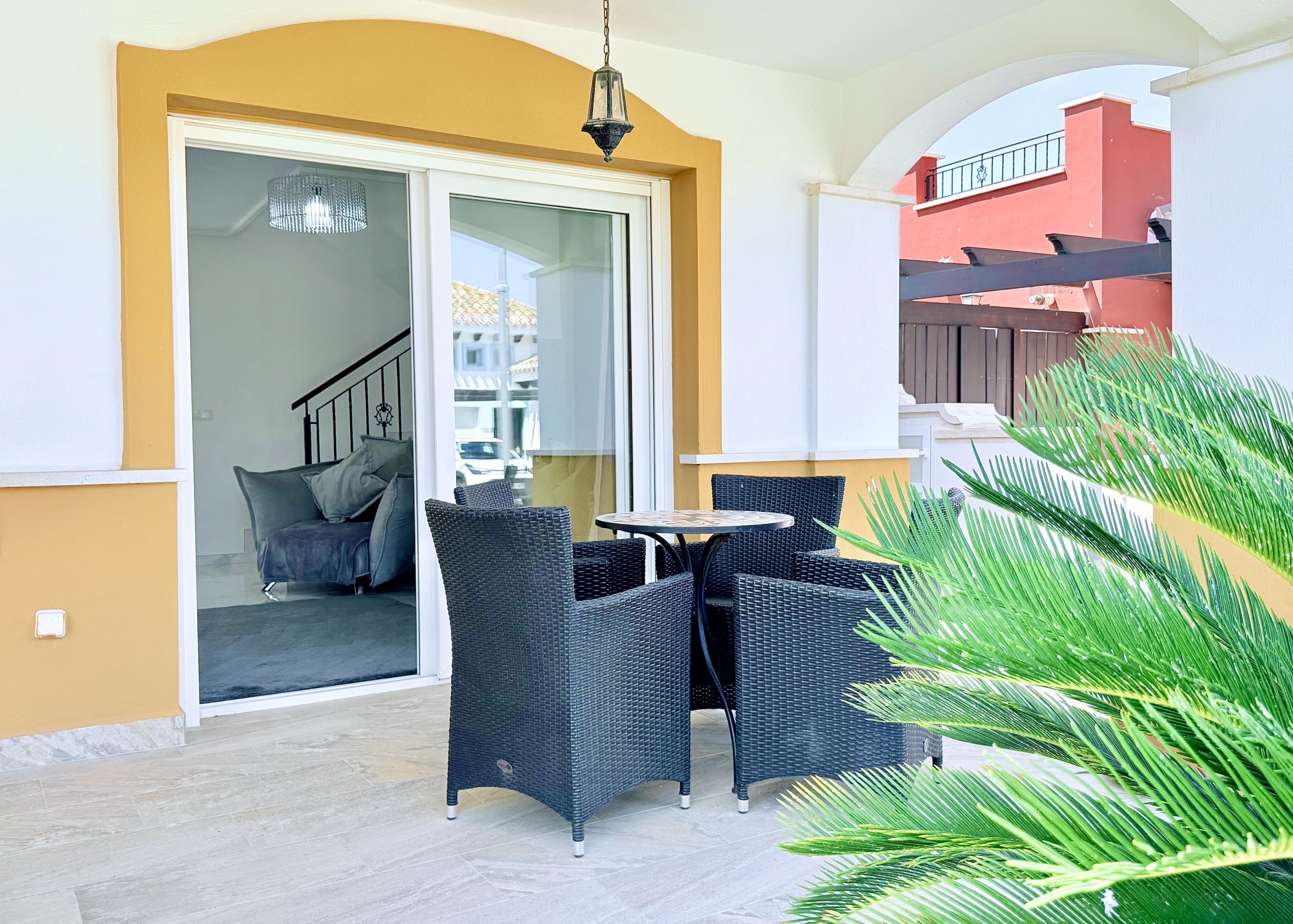 Private patio accessed from the open-plan lounge at Isla Grosa Villa on Mar Menor Golf Resort by Levante Properties