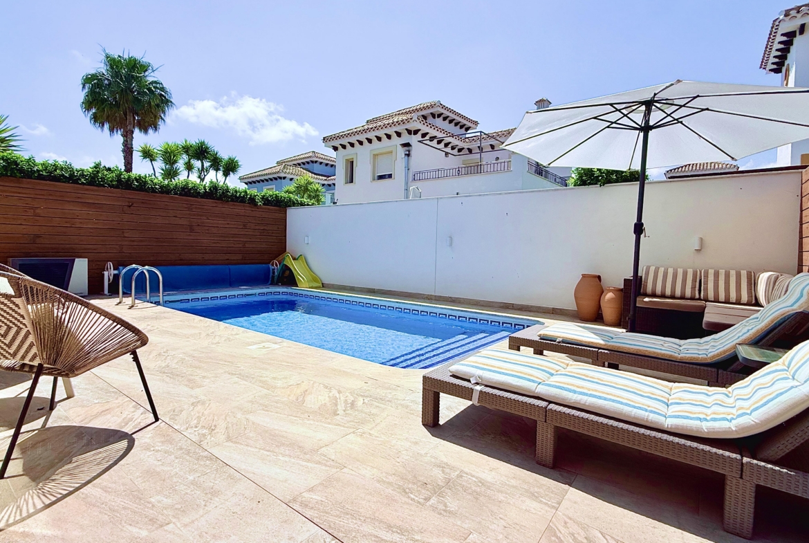Heated swimming pool at fully renovated Isla Grosa Villa for sale on Mar Menor Golf Resort by Levante Properties
