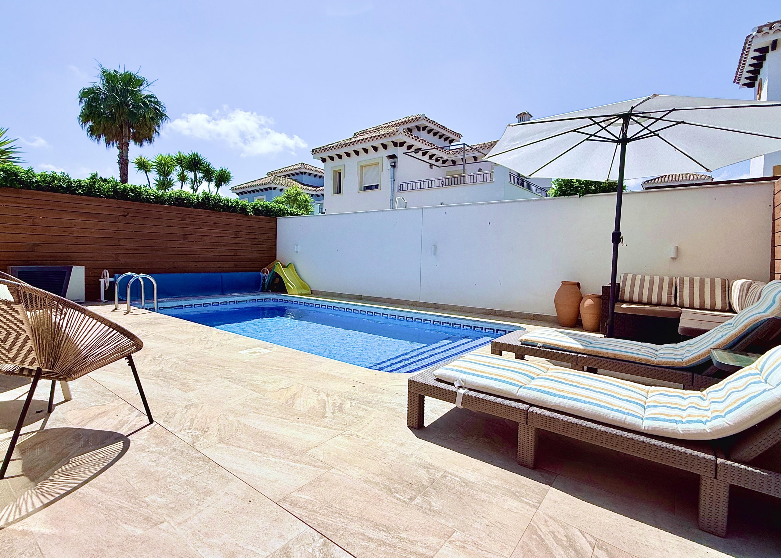 Heated swimming pool at fully renovated Isla Grosa Villa for sale on Mar Menor Golf Resort by Levante Properties