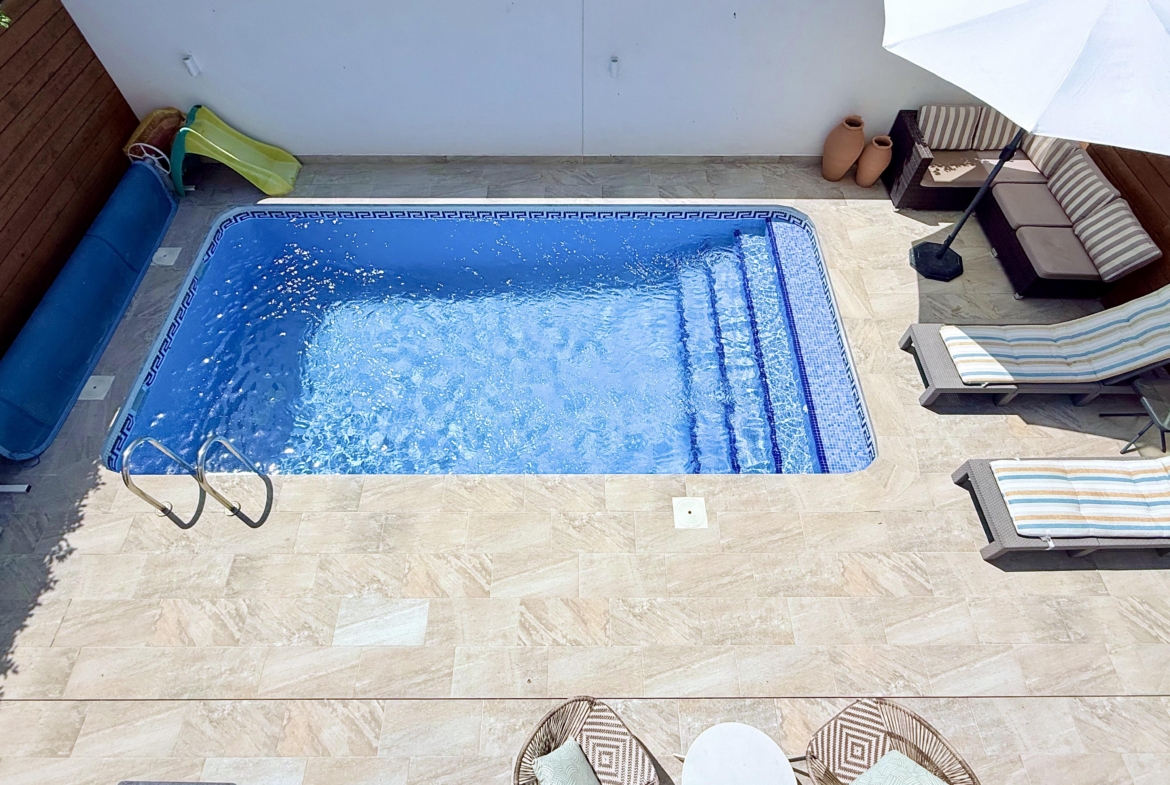 Heated swimming pool at fully renovated Isla Grosa Villa for sale on Mar Menor Golf Resort by Levante Properties