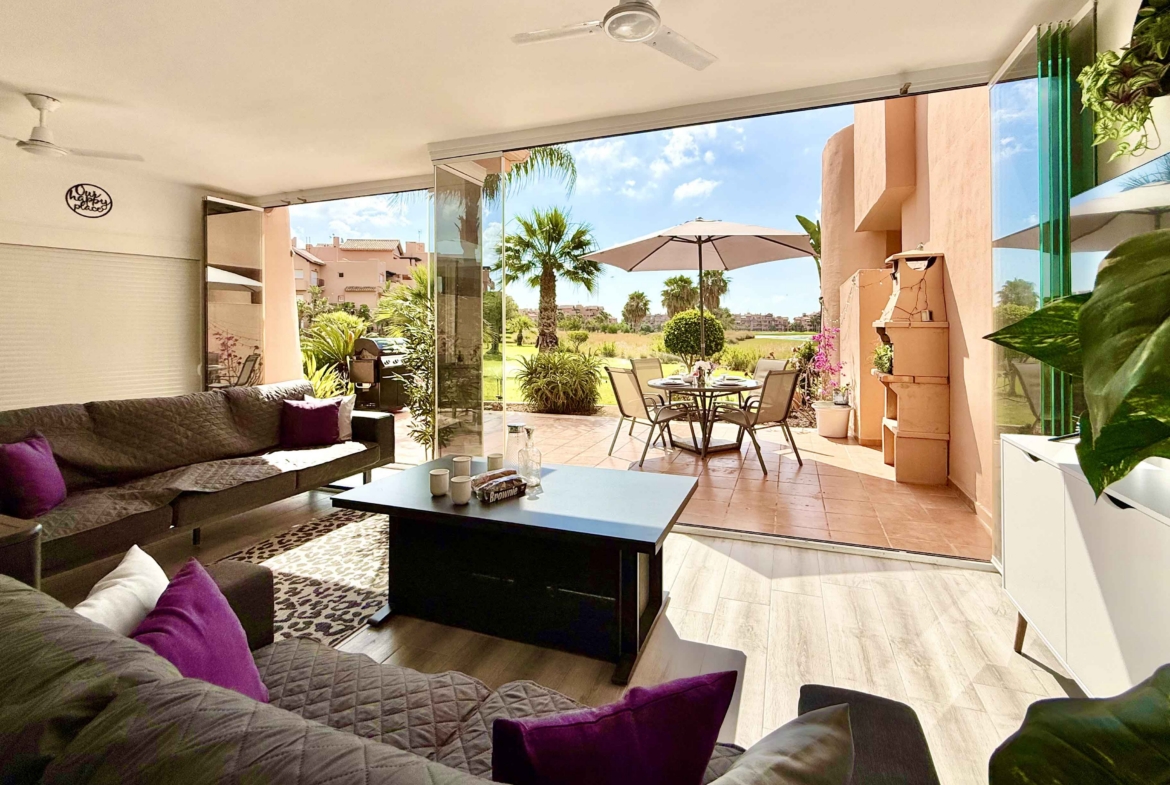Glass curtain enclosed terrace creating a second lounge at Mar Menor Golf Resort | Levante Properties