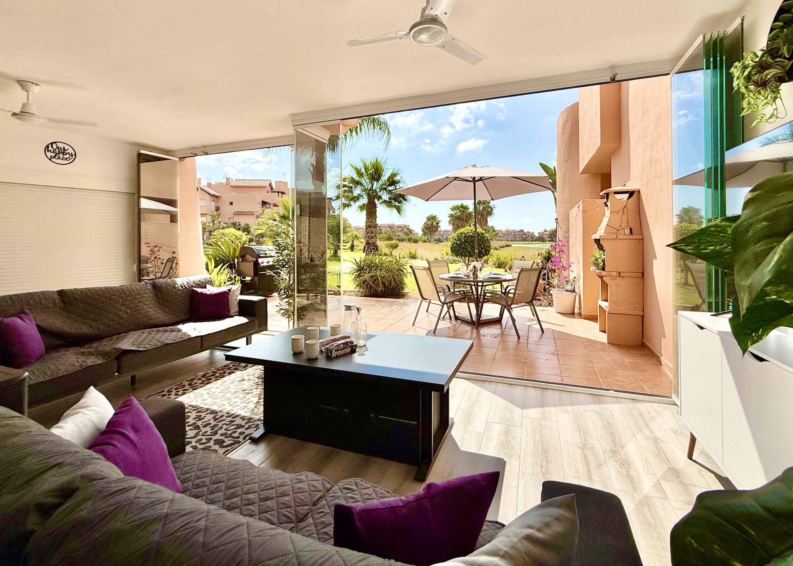 Glass curtain enclosed terrace creating a second lounge at Mar Menor Golf Resort | Levante Properties