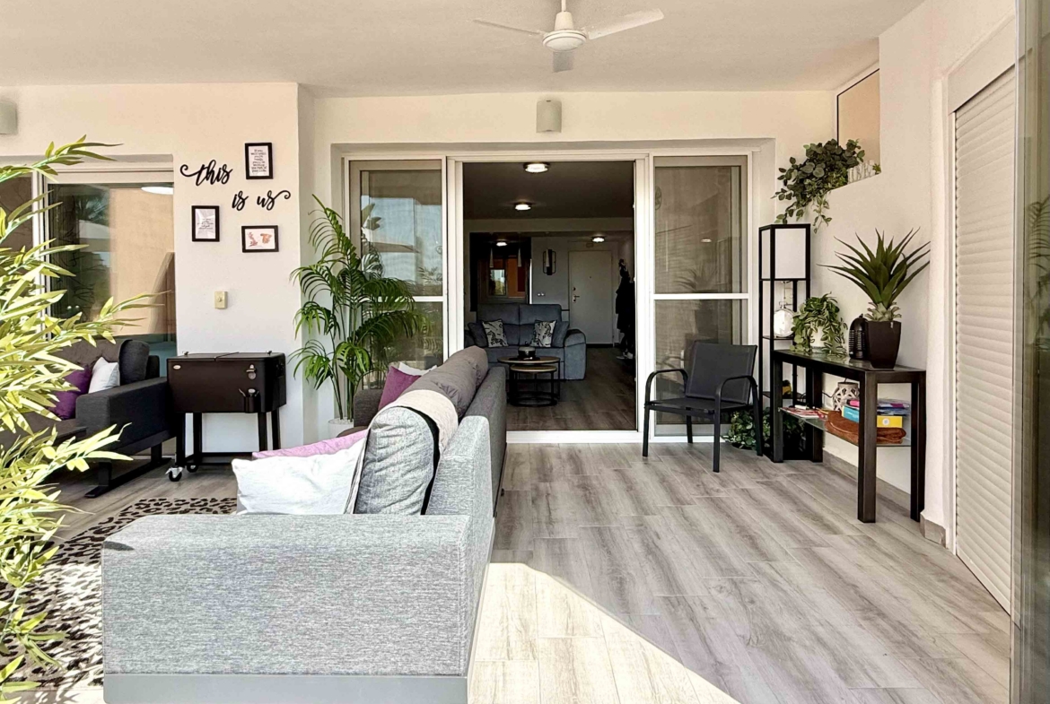 Glass curtain enclosed terrace creating a second lounge at Mar Menor Golf Resort | Levante Properties