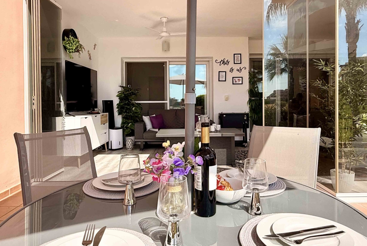 Glass curtain enclosed terrace creating a second lounge at Mar Menor Golf Resort | Levante Properties