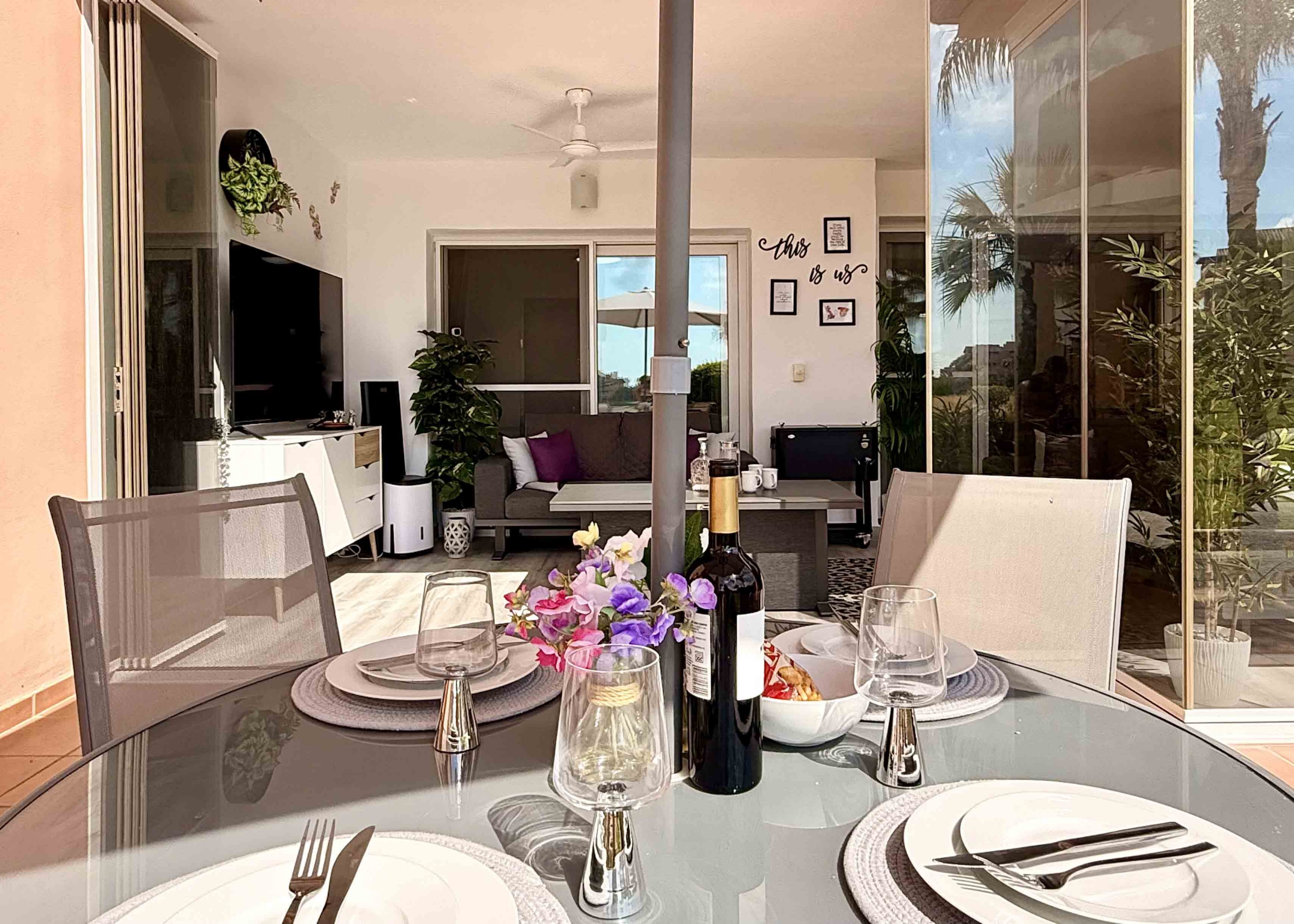 Glass curtain enclosed terrace creating a second lounge at Mar Menor Golf Resort | Levante Properties