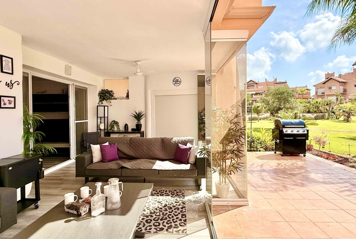 Glass curtain enclosed terrace creating a second lounge at Mar Menor Golf Resort | Levante Properties
