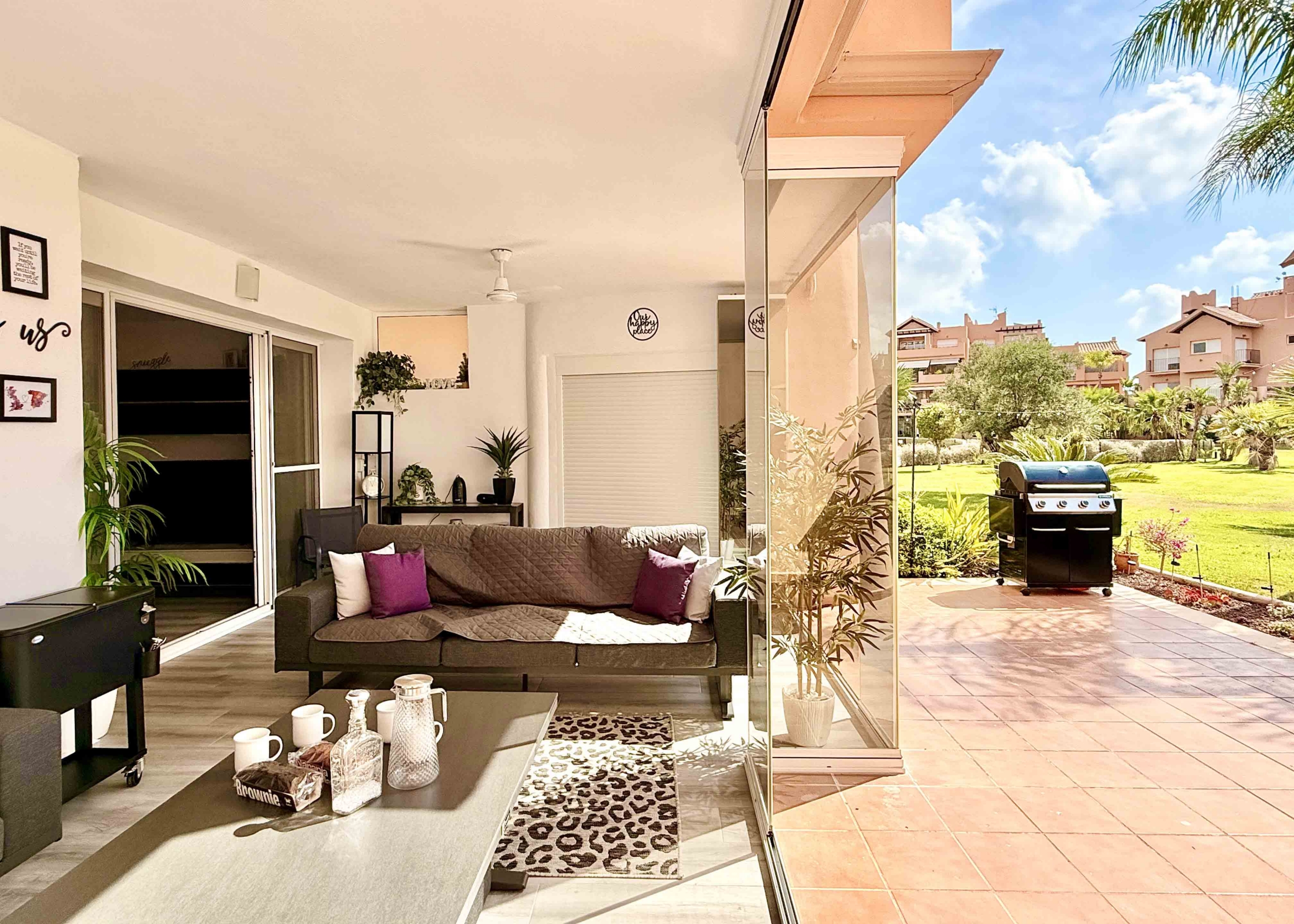 Glass curtain enclosed terrace creating a second lounge at Mar Menor Golf Resort | Levante Properties