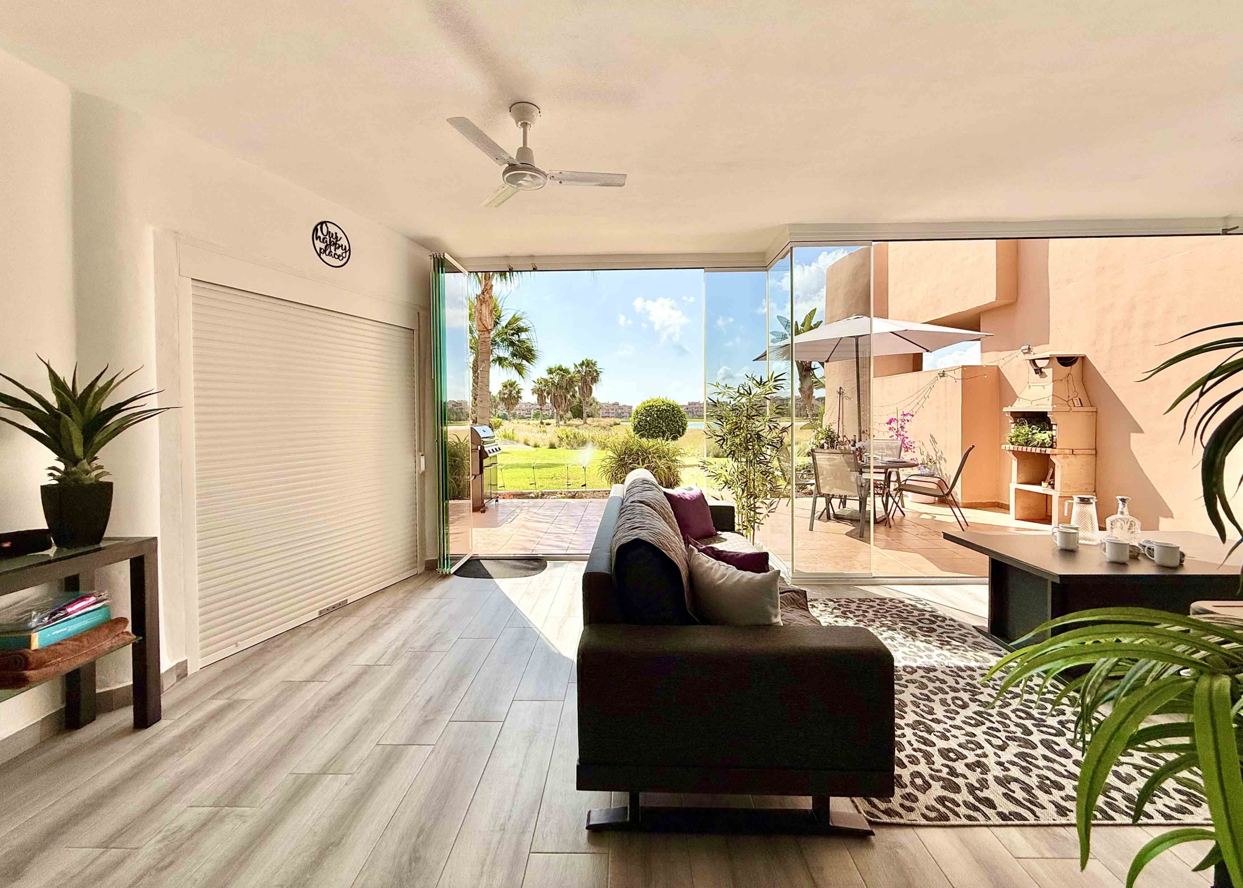 Glass curtain enclosed terrace creating a second lounge at Mar Menor Golf Resort | Levante Properties