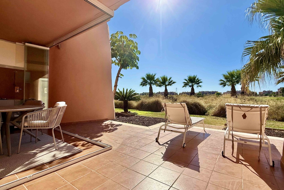 Private west-facing terrace with sun loungers at an upgraded one-bedroom apartment on Mar Menor Golf Resort, exclusively marketed by Levante Properties.