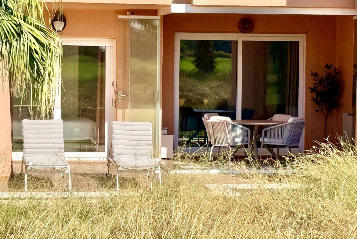 Private west-facing terrace with sun loungers at an upgraded one-bedroom apartment on Mar Menor Golf Resort, exclusively marketed by Levante Properties.