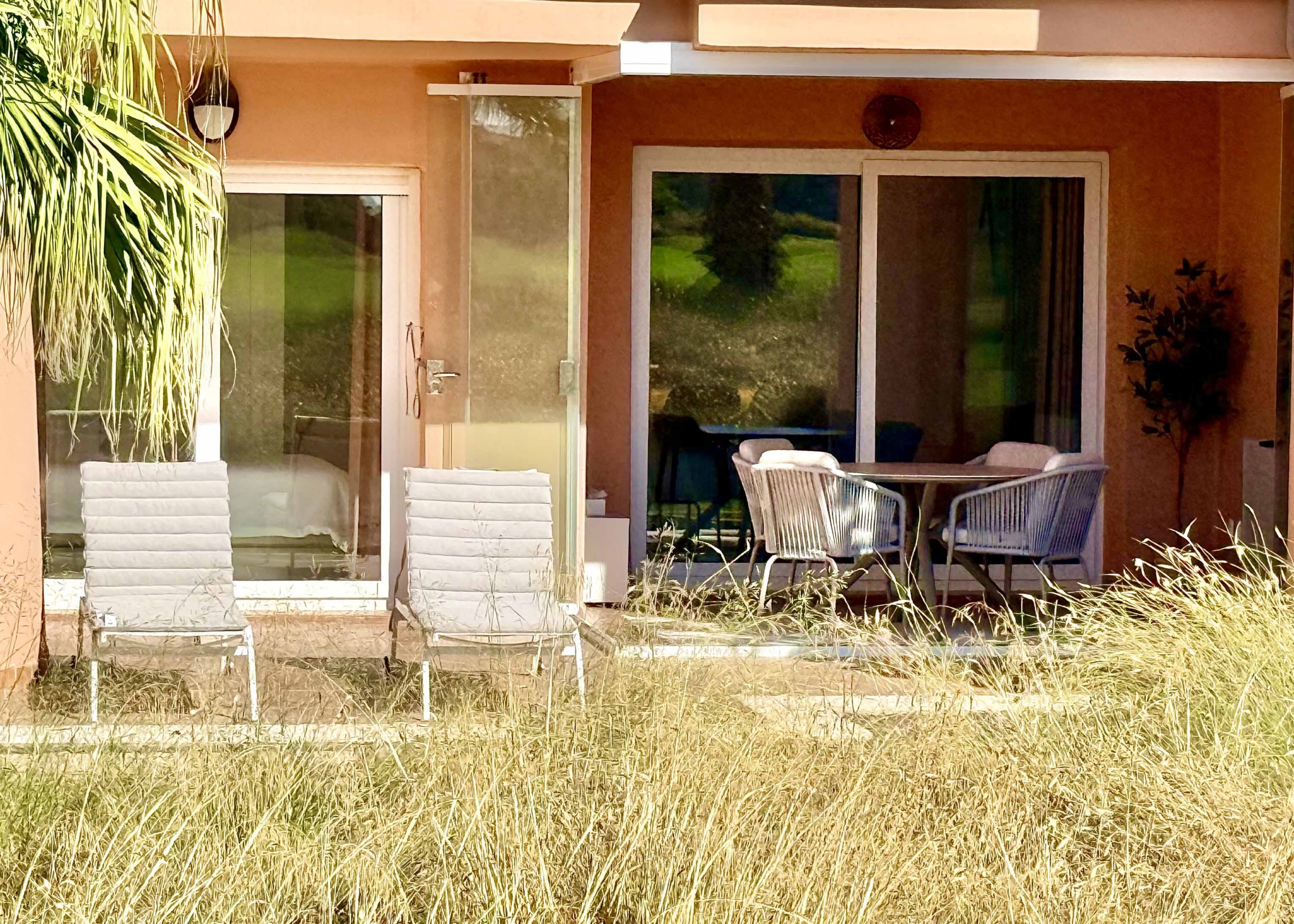 Private west-facing terrace with sun loungers at an upgraded one-bedroom apartment on Mar Menor Golf Resort, exclusively marketed by Levante Properties.