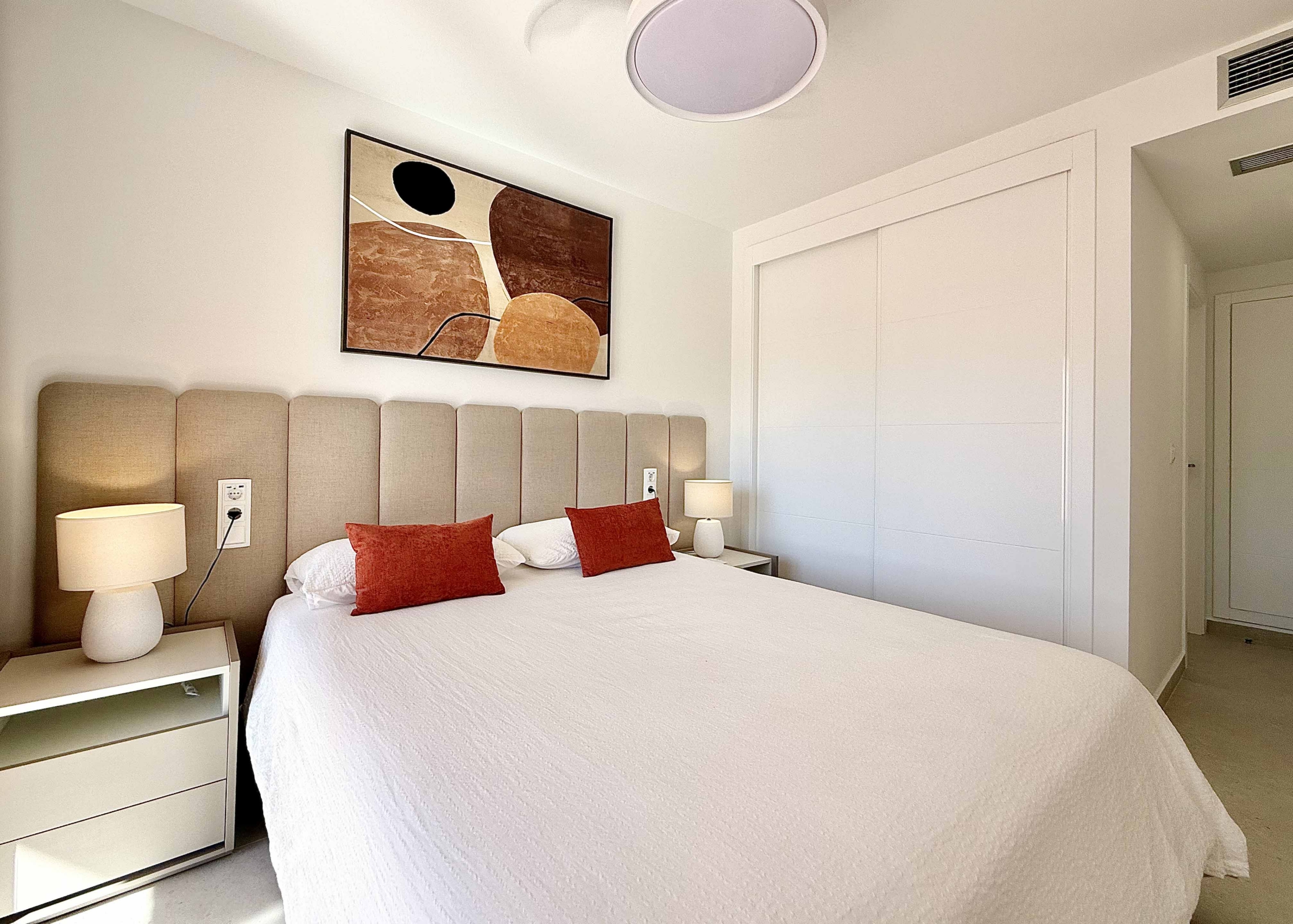 Modern master bedroom in an upgraded one-bedroom apartment for sale on Mar Menor Golf Resort with direct terrace access, exclusively by Levante Properties.