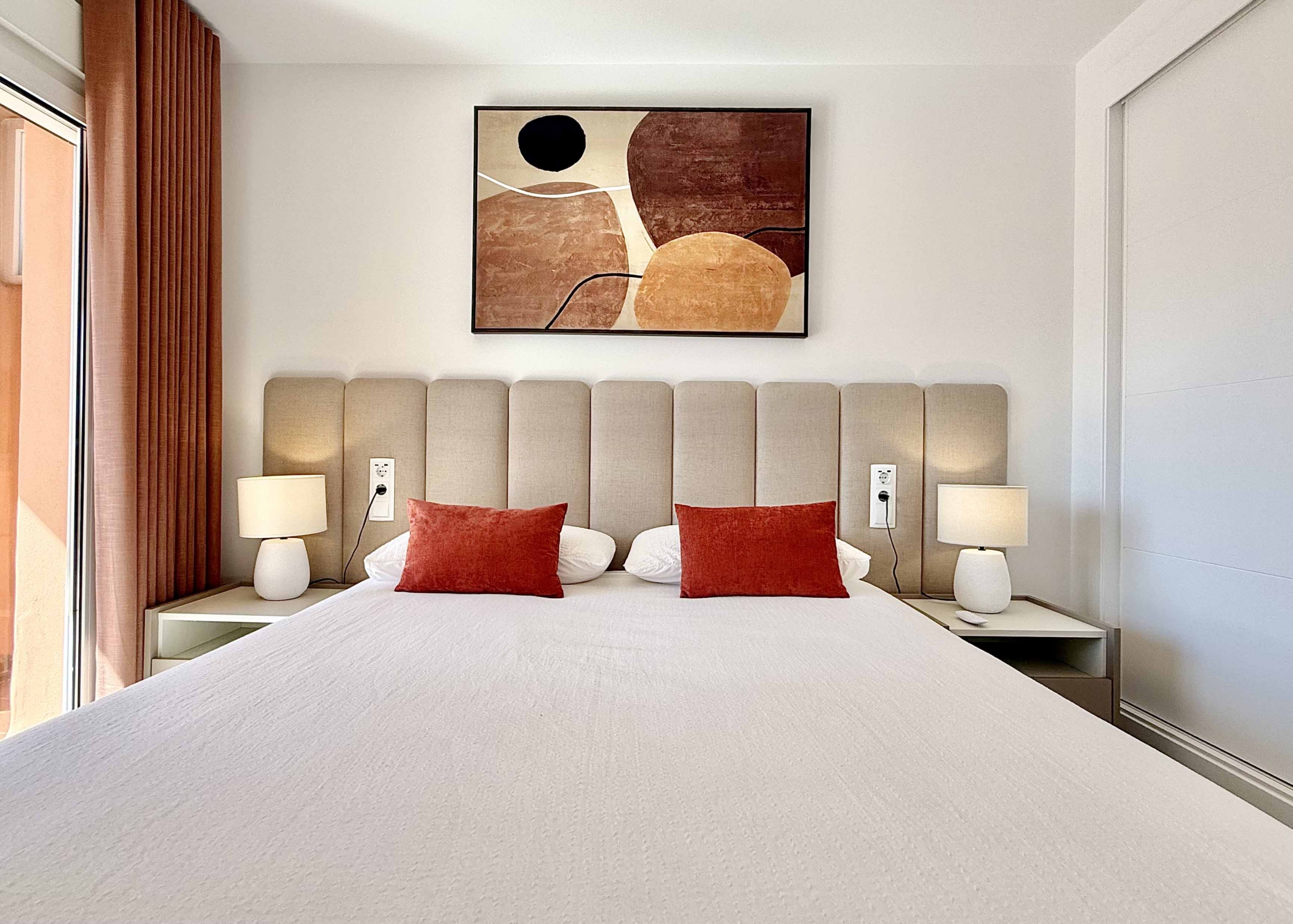 Modern master bedroom in an upgraded one-bedroom apartment for sale on Mar Menor Golf Resort with direct terrace access, exclusively by Levante Properties.