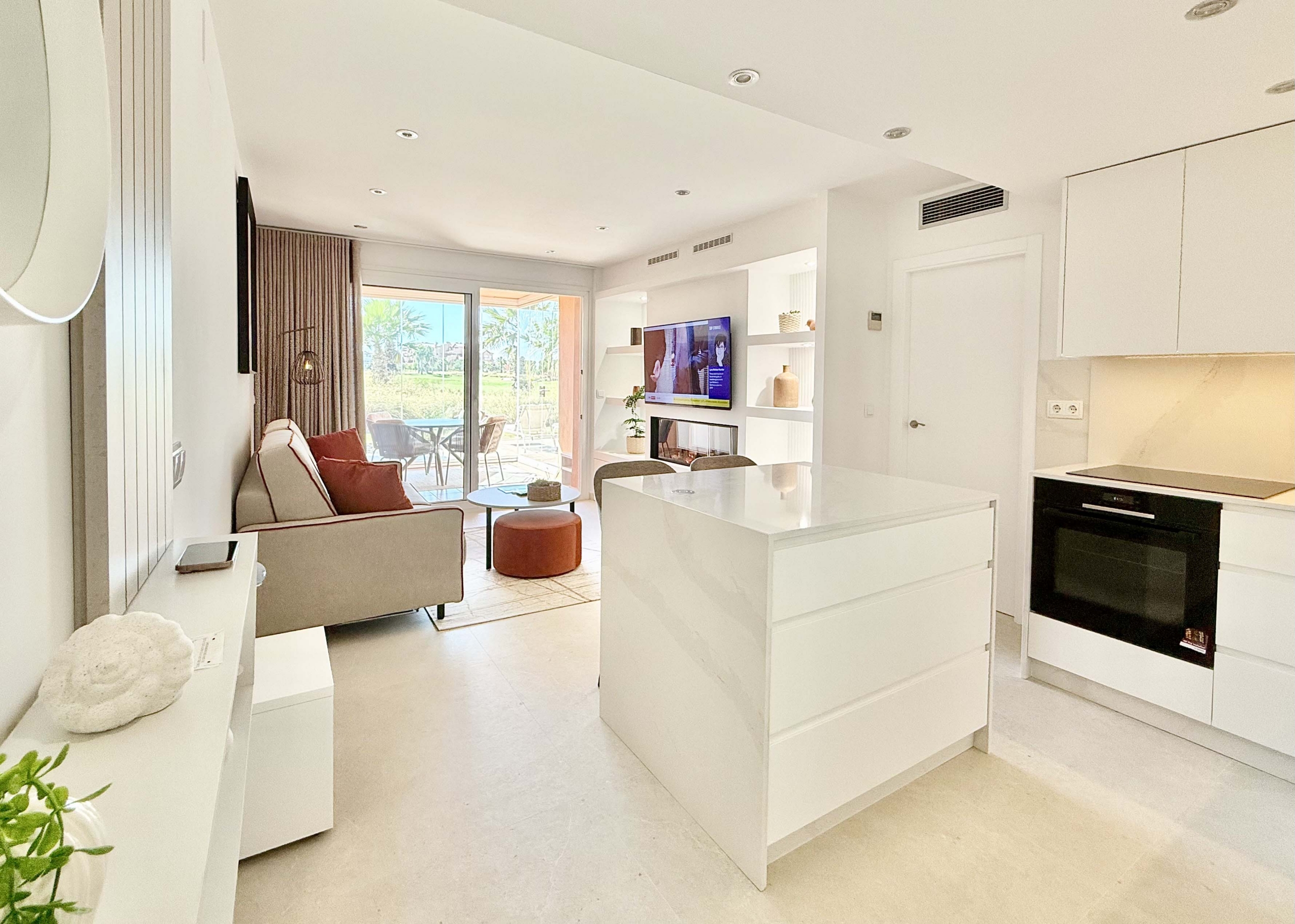Modern living room in an upgraded one-bedroom apartment for sale on Mar Menor Golf Resort with golf views, exclusively marketed by Levante Properties.
