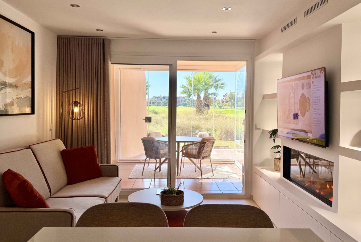 Modern living room in an upgraded one-bedroom apartment for sale on Mar Menor Golf Resort with golf views, exclusively marketed by Levante Properties.