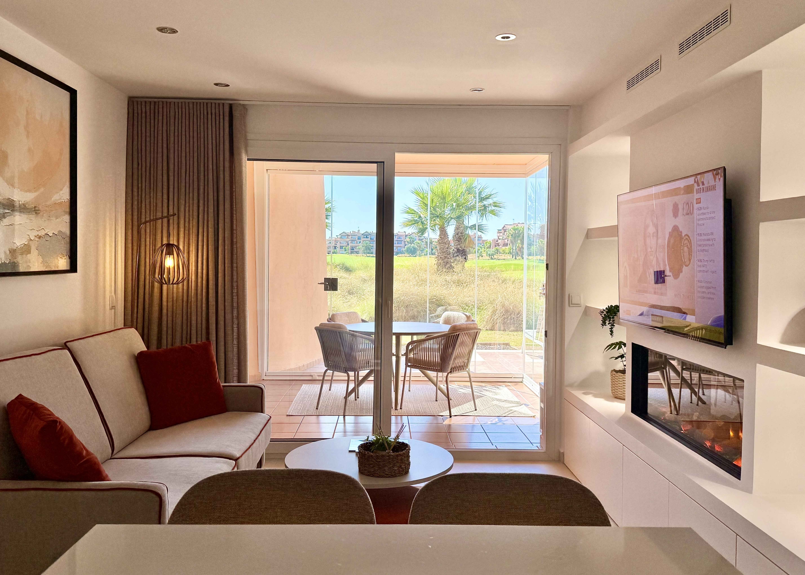 Modern living room in an upgraded one-bedroom apartment for sale on Mar Menor Golf Resort with golf views, exclusively marketed by Levante Properties.