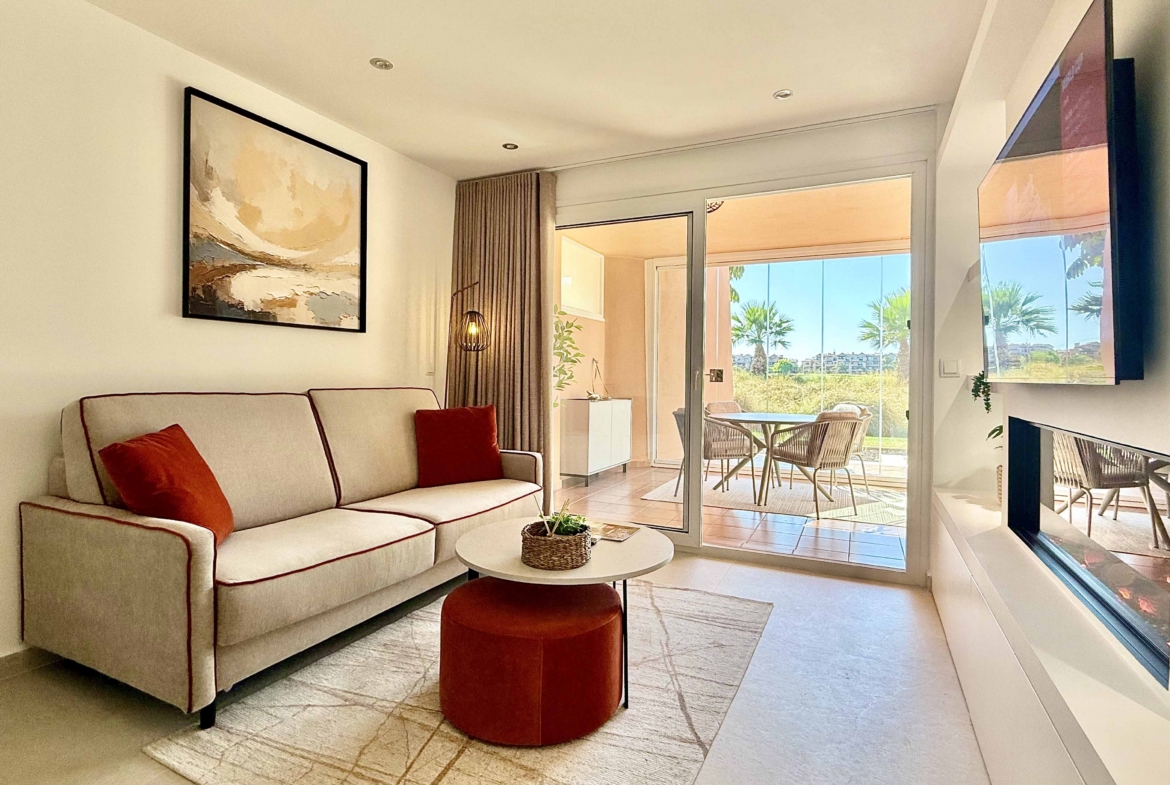 Modern living room in an upgraded one-bedroom apartment for sale on Mar Menor Golf Resort with golf views, exclusively marketed by Levante Properties.
