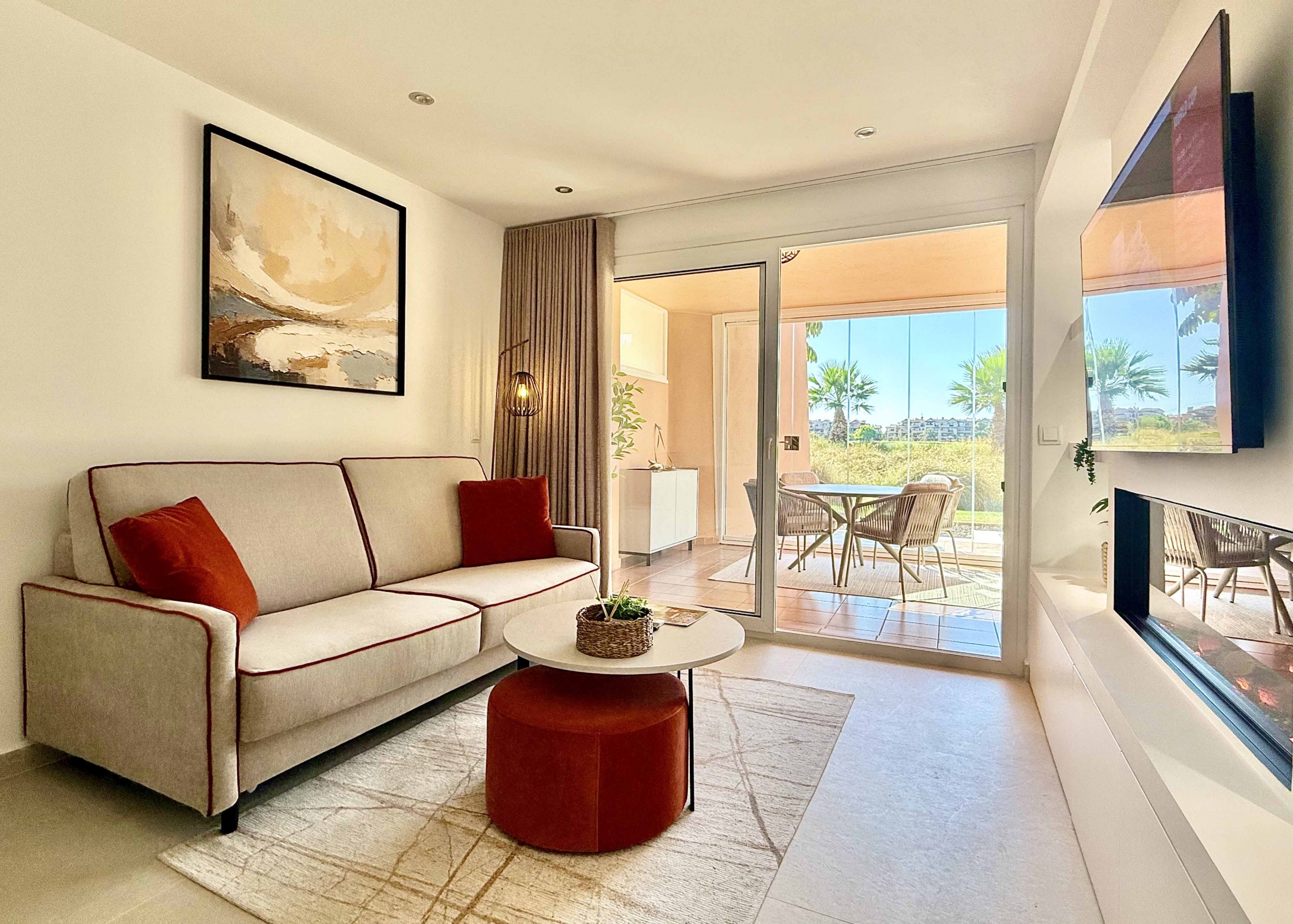 Modern living room in an upgraded one-bedroom apartment for sale on Mar Menor Golf Resort with golf views, exclusively marketed by Levante Properties.