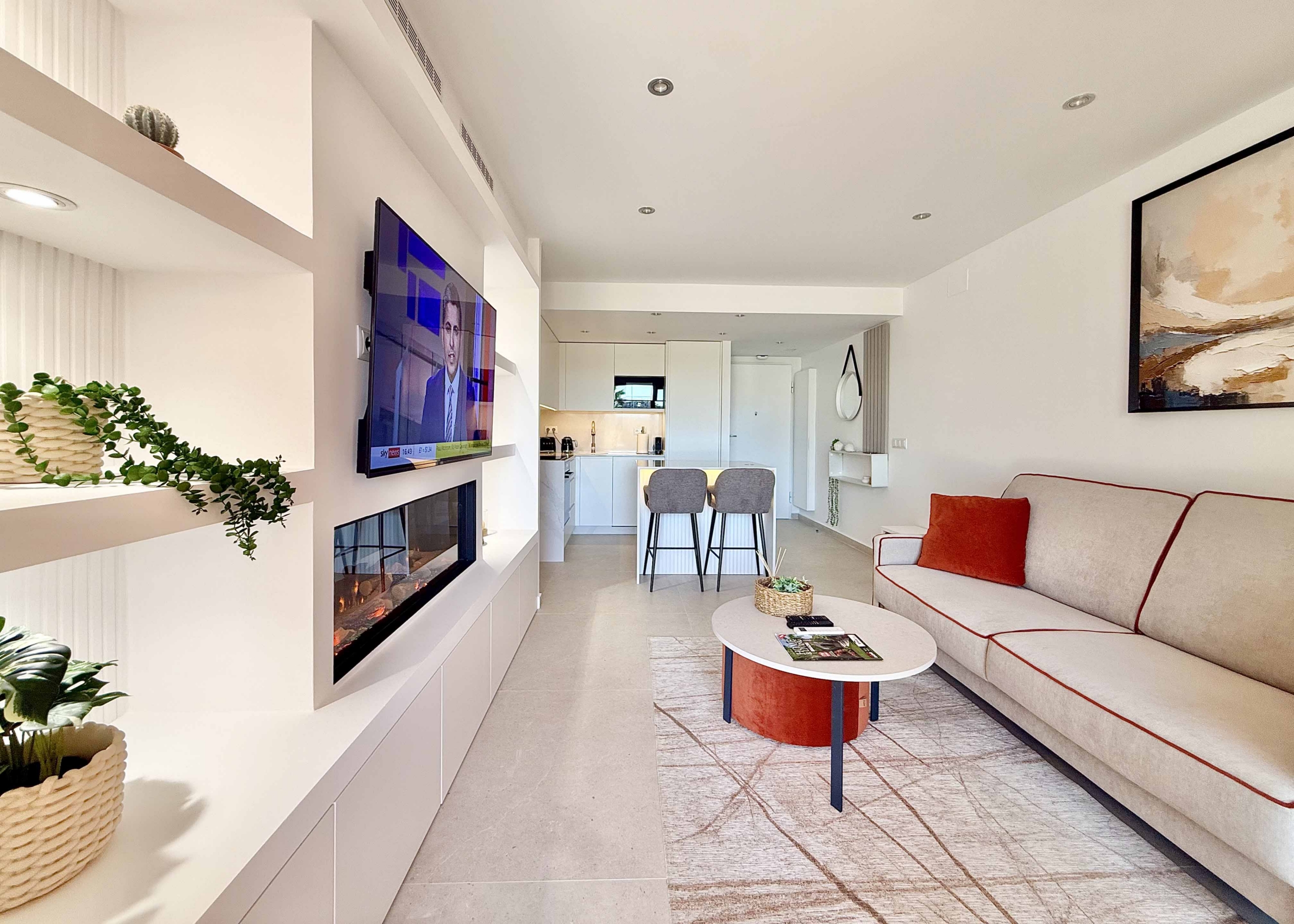 Modern living room in an upgraded one-bedroom apartment for sale on Mar Menor Golf Resort with golf views, exclusively marketed by Levante Properties.