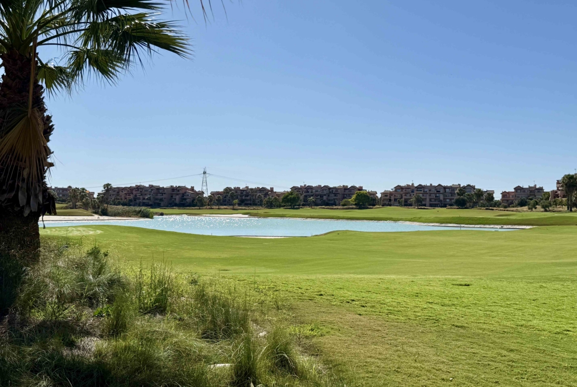 Panoramic golf course and lake views from an upgraded one-bedroom apartment on Mar Menor Golf Resort, exclusively marketed by Levante Properties.