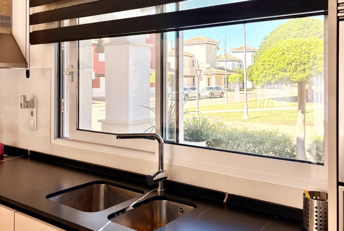 Modern open-plan kitchen in Baron villa on Mar Menor Golf Resort