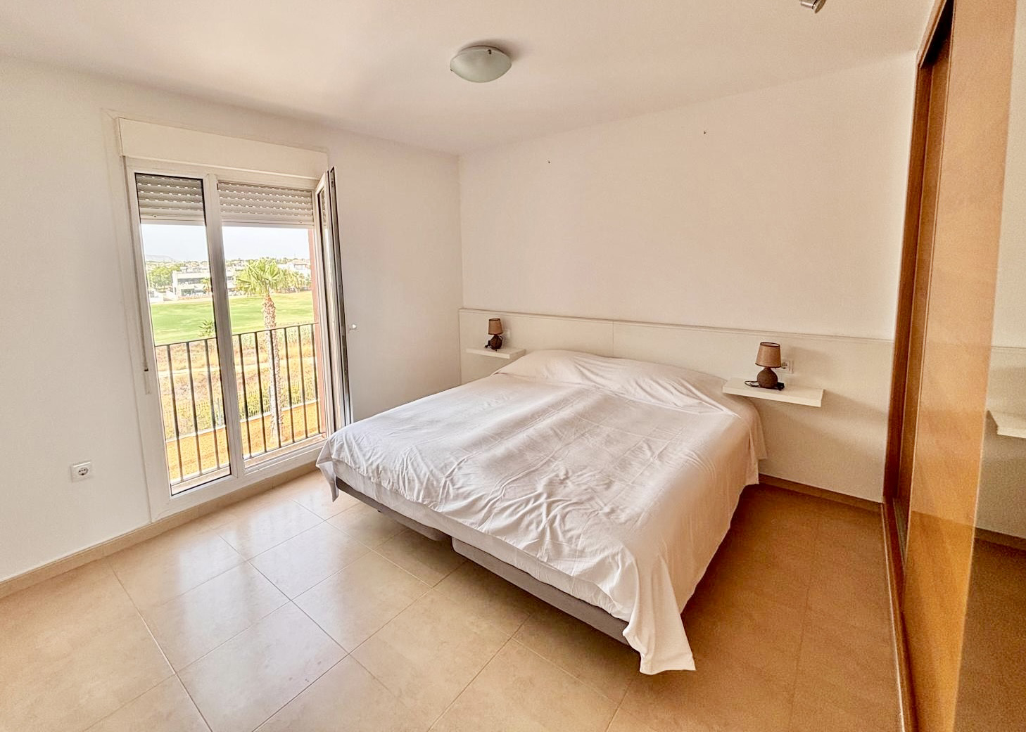 Master bedroom with golf course views in a Boulevard apartment on Mar Menor Golf Resort